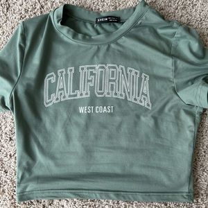 Green cropped graphics tee